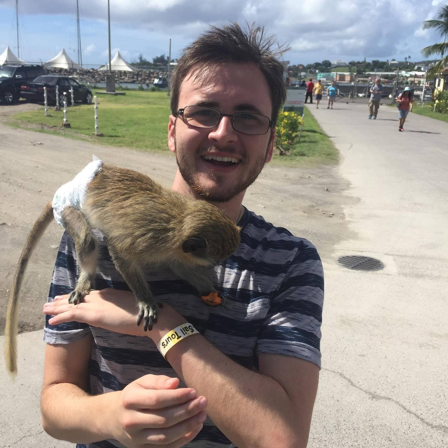 Alex Wade with a friendly monkey companion